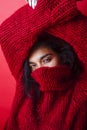 Young pretty indian mulatto girl in red sweater posing emotional Royalty Free Stock Photo