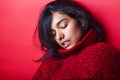 Young pretty indian mulatto girl in red sweater posing emotional Royalty Free Stock Photo