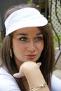 Young pretty italian woman with tennis hat Royalty Free Stock Photo