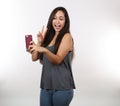 Pretty Girl in Jeans Takes a Picture On Her Phone Royalty Free Stock Photo