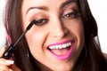 Young Pretty Latino Woman Putting on mascara