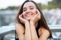 Young pretty likable cheerful woman posing summer city outdoor in Kyiv, Ukraine. Beautiful self-confident girl with long brown Royalty Free Stock Photo