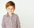 Young pretty little cute boy kid wondering, posing emotional face isolated on white background, gesture happy smiling Royalty Free Stock Photo