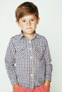 Young pretty little cute boy kid wondering, posing emotional face isolated on white background, gesture happy smiling Royalty Free Stock Photo