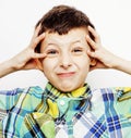 Young pretty little cute boy kid wondering, posing emotional face isolated on white background, gesture happy smiling Royalty Free Stock Photo