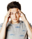 Young pretty man with head ache holding hands close up thinking Royalty Free Stock Photo