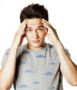 Young pretty man with head ache holding hands Royalty Free Stock Photo