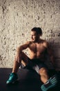 Pretty man tired after weightlifting at gym Royalty Free Stock Photo