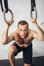 Pretty man tired after weightlifting at gym Royalty Free Stock Photo