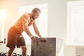 Pretty man tired after weightlifting at gym Royalty Free Stock Photo