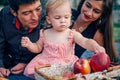 Young pretty mother, father and their little cute daughter Royalty Free Stock Photo