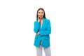 young pretty office worker woman in a blue business jacket on a white background with copy space Royalty Free Stock Photo