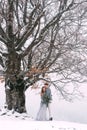 Young pretty pair of lovers. Winter. Date. A pair of lovers on a date in the mountains.