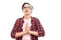 Young pretty pin-up girl wearing glasses showing praying gesture Royalty Free Stock Photo