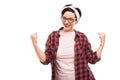 Young pretty pin-up girl wearing glasses showing winning gesture