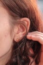 Young pretty redhair woman ear closeup Royalty Free Stock Photo
