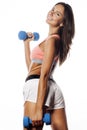 Young pretty slim woman with dumbbell isolated Royalty Free Stock Photo