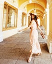 Young pretty smiling woman in hat with bags on shopping at store Royalty Free Stock Photo