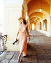 Young pretty smiling woman in hat with bags on shopping at store Royalty Free Stock Photo