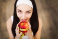 Young pretty smiling woman standing holding red apple.Concept for healthy food Royalty Free Stock Photo