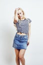 Young pretty stylish blond hipster girl posing emotional isolate Royalty Free Stock Photo