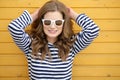 Young pretty stylish smiling woman making selfie photo on camera in city park, positive, emotional, wearing yellow top Royalty Free Stock Photo