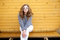 Young pretty stylish smiling woman making selfie photo on camera in city park, positive, emotional, wearing yellow top Royalty Free Stock Photo