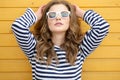 Young pretty stylish smiling woman making selfie photo on camera in city park, positive, emotional, wearing yellow top Royalty Free Stock Photo