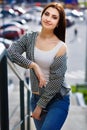 Young pretty stylish smiling woman wearing fashionable blue jean Royalty Free Stock Photo