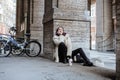 Young pretty stylish teenage girl outside on city street fancy fashion dressed drinking milk shake Royalty Free Stock Photo