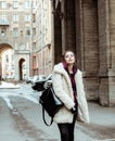 Young pretty stylish teenage girl outside on city street fancy fashion dressed drinking milk shake Royalty Free Stock Photo