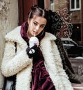 Young pretty stylish teenage girl outside on city street fancy fashion dressed drinking milk shake Royalty Free Stock Photo