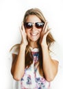 Young pretty teen blond girl posing cheerful isolated on white background wearing sunglasses, lifestyle people concept Royalty Free Stock Photo