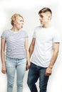 Young pretty teenage couple, hipster guy with his girlfriend happy smiling and hugging isolated on white background Royalty Free Stock Photo