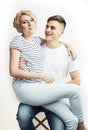 Young pretty teenage couple, hipster guy with his girlfriend happy smiling and hugging isolated on white background Royalty Free Stock Photo