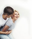 Young pretty teenage couple, hipster guy with his girlfriend happy smiling and hugging isolated on white background Royalty Free Stock Photo