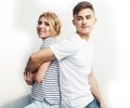 Young pretty teenage couple, hipster guy with his girlfriend happy smiling and hugging isolated on white background Royalty Free Stock Photo