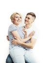 Young pretty teenage couple, hipster guy with his girlfriend happy smiling and hugging isolated on white background Royalty Free Stock Photo