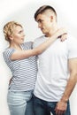 Young pretty teenage couple, hipster guy with his girlfriend happy smiling and hugging isolated on white background Royalty Free Stock Photo