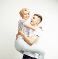 Young pretty teenage couple, hipster guy with his girlfriend happy smiling and hugging isolated on white background Royalty Free Stock Photo