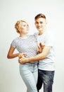 Young pretty teenage couple, hipster guy with his girlfriend happy smiling and hugging on white background Royalty Free Stock Photo
