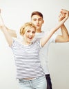 Young pretty teenage couple, hipster guy with his girlfriend happy smiling and hugging on white background Royalty Free Stock Photo