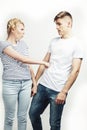 Young pretty teenage couple, hipster guy with his girlfriend happy smiling and hugging  on white background Royalty Free Stock Photo