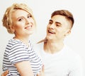 Young pretty teenage couple, hipster guy with his girlfriend happy smiling and hugging on white background Royalty Free Stock Photo