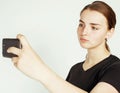 Young pretty teenage girl making selfie isolated on white background close up Royalty Free Stock Photo