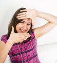 Young pretty teenage modern hipster girl posing emotional happy isolated on white background, wearing pink t-shirt