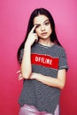 Young pretty teenage woman emotional posing on pink background, fashion lifestyle people concept Royalty Free Stock Photo