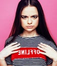 Young pretty teenage woman emotional posing on pink background, fashion lifestyle people concept Royalty Free Stock Photo
