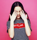 Young pretty teenage woman emotional posing on pink background, fashion lifestyle people concept Royalty Free Stock Photo