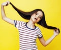 Young pretty teenage woman emotional posing on yellow background, fashion lifestyle people concept Royalty Free Stock Photo